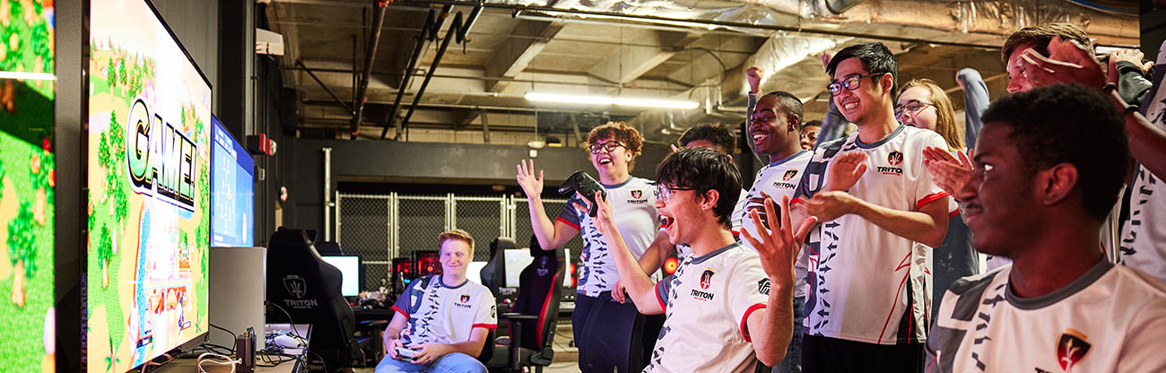 group of esports players reacting to a win